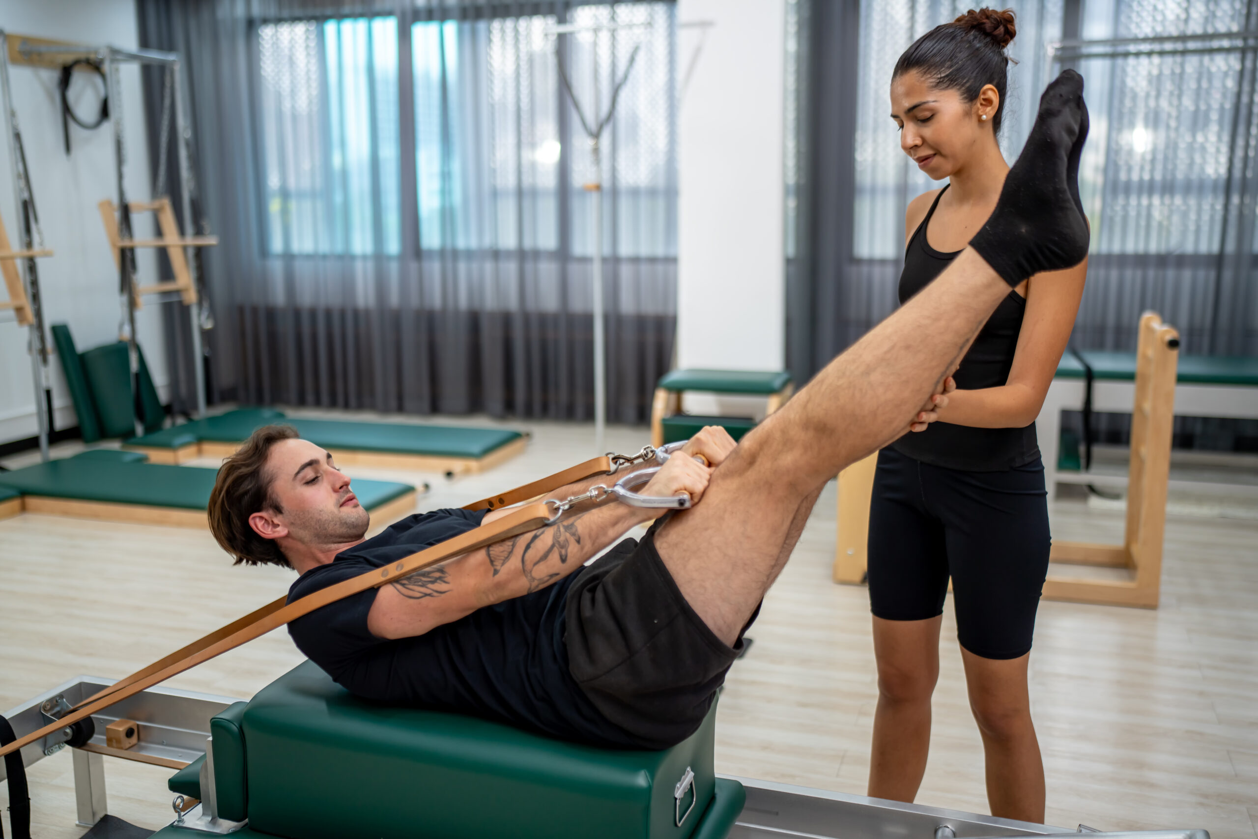 Physical therapy being performed by an instructor to a patient