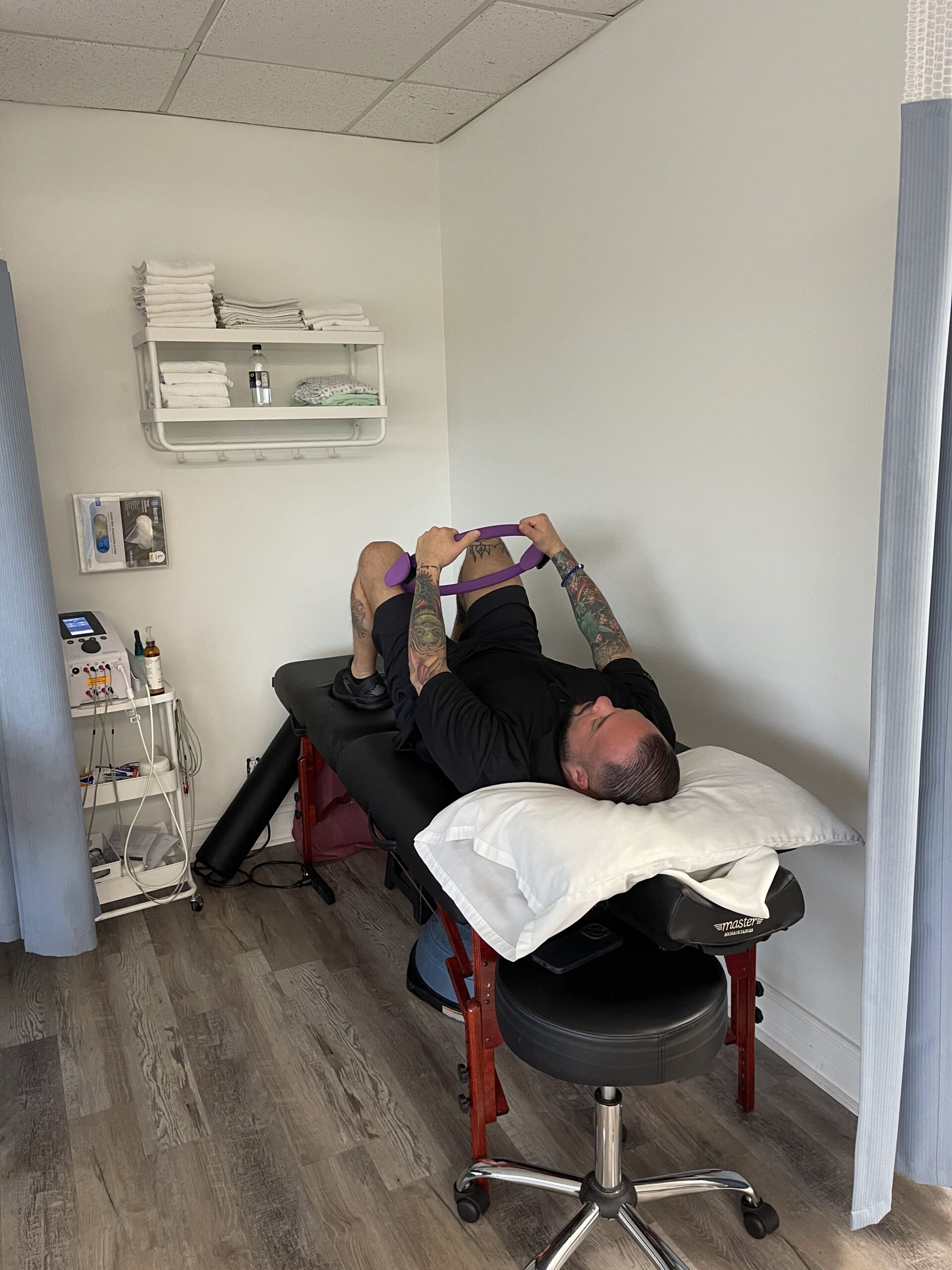 Patient performing resistance band exercises during a physical therapy session focused on lower body rehabilitation at a Deerfield Beach clinic.