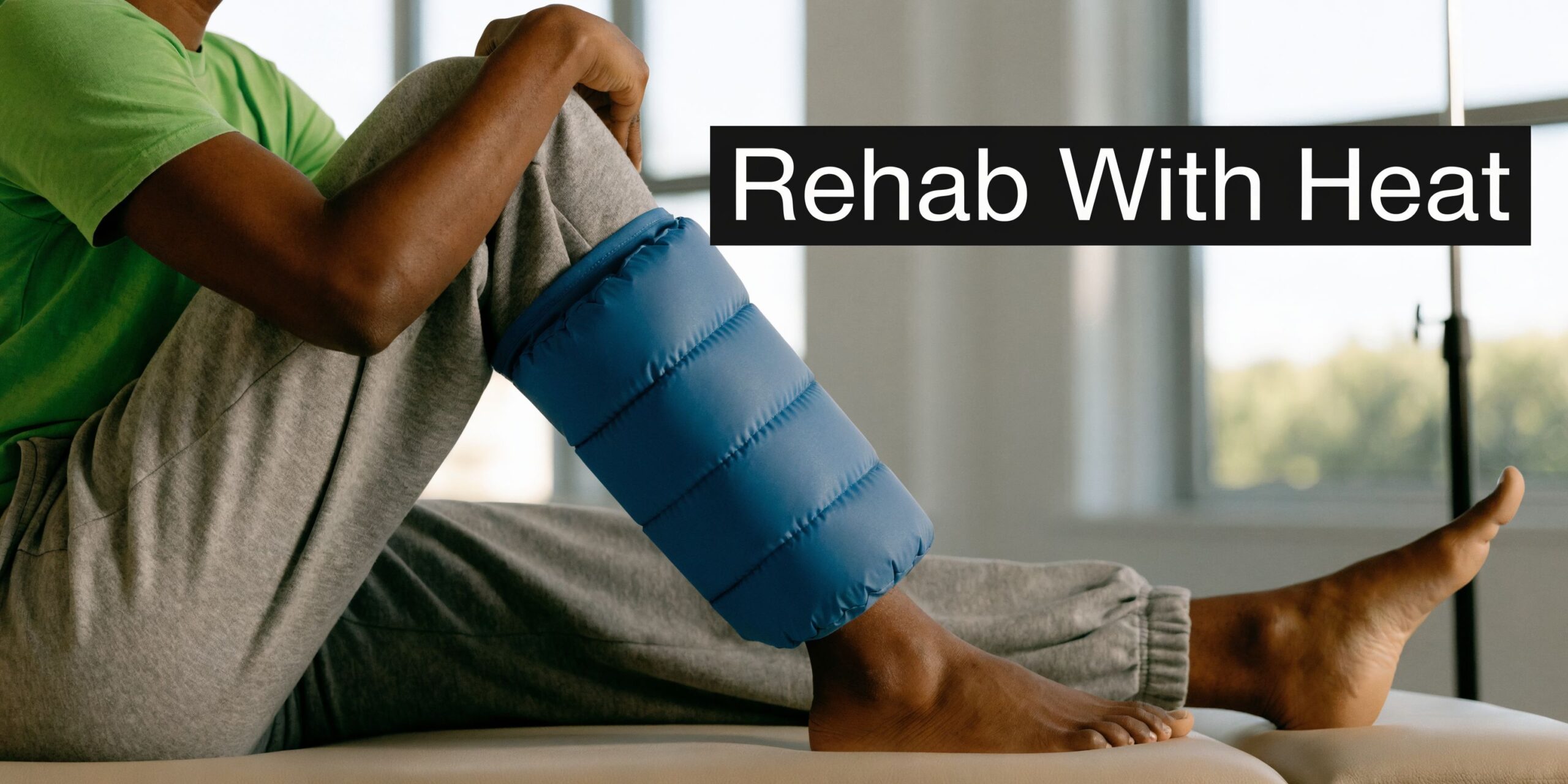 A patient with dark skin wearing a green t-shirt applies a blue heat pack to their leg.